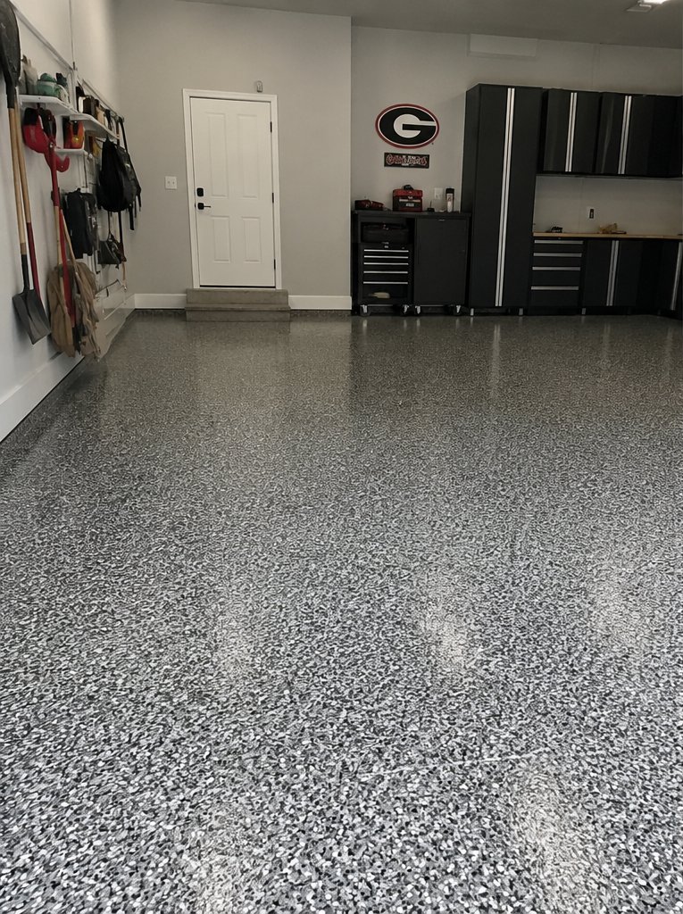 Residential garage with full-flake polyaspartic chip floor in grayscale tones