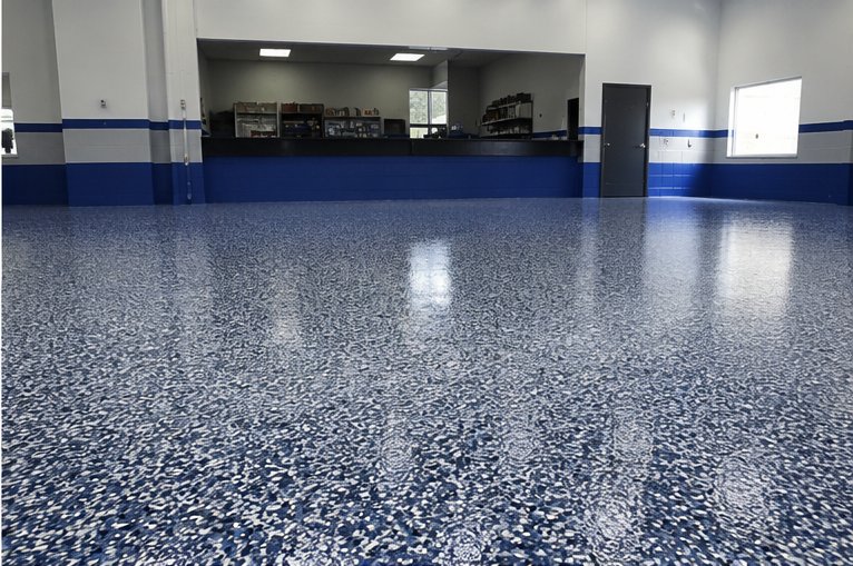 Commercial shop interior with blue and white flake-broadcast epoxy floor