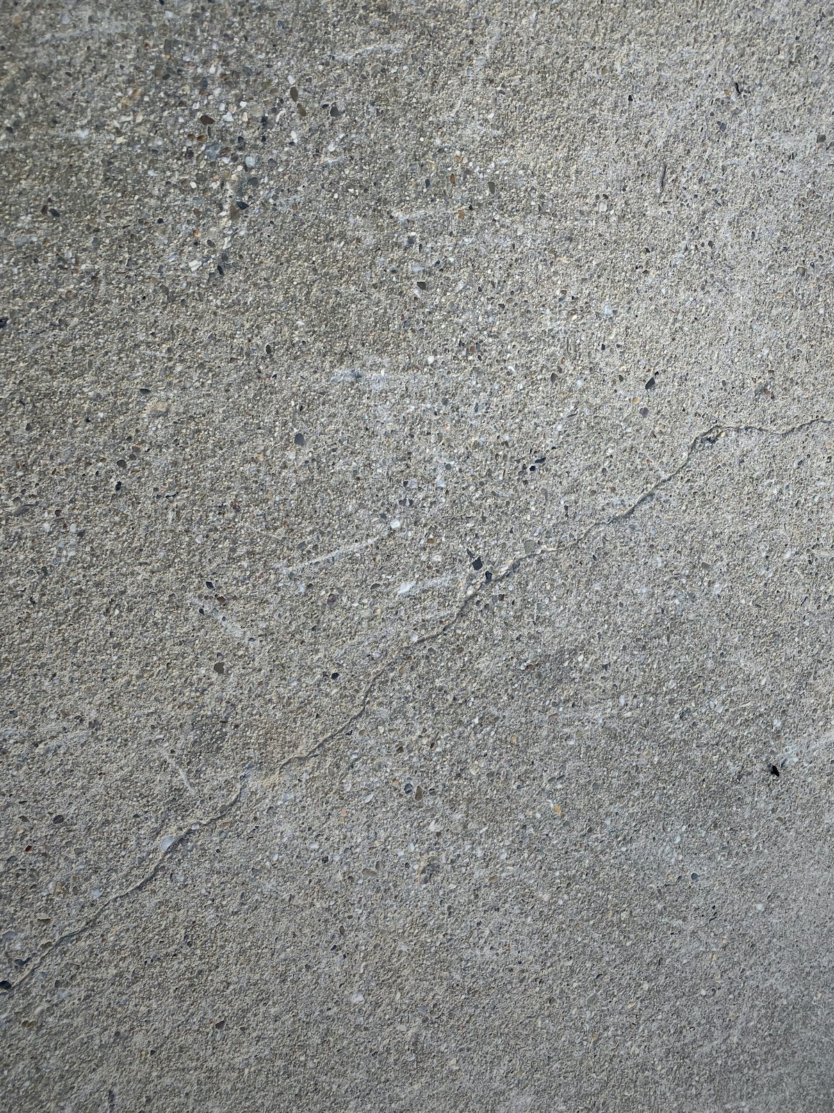 Weathered outdoor concrete patio surface before coating