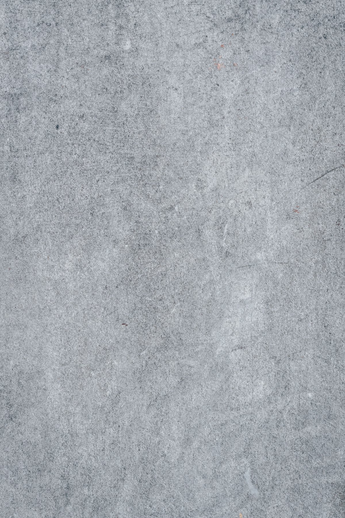 Plain mottled concrete shop floor before resurfacing