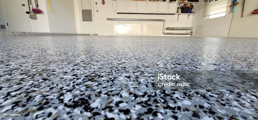 Blue, white, and black chip-broadcast garage floor finish