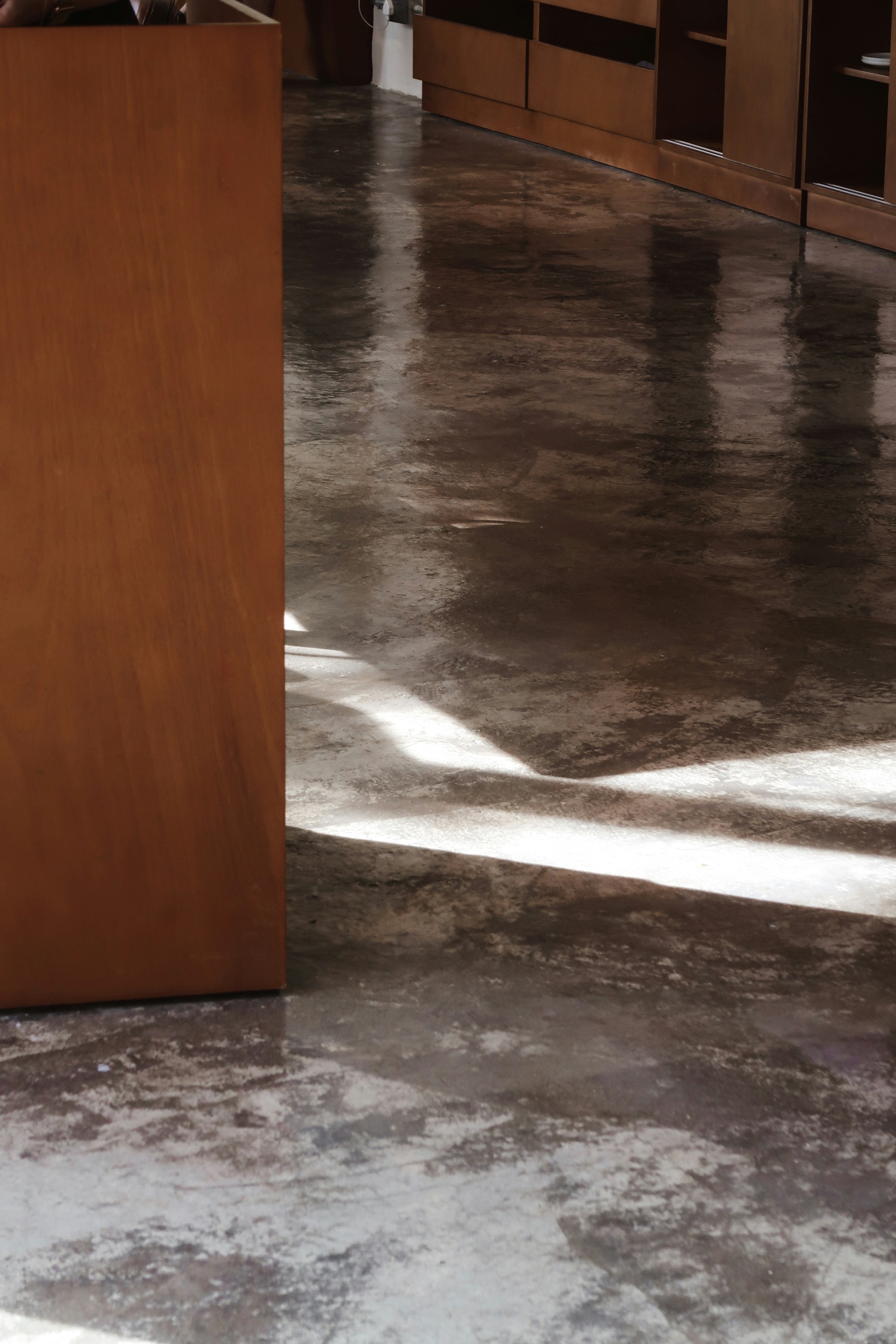 Polished concrete floor with reflective sheen